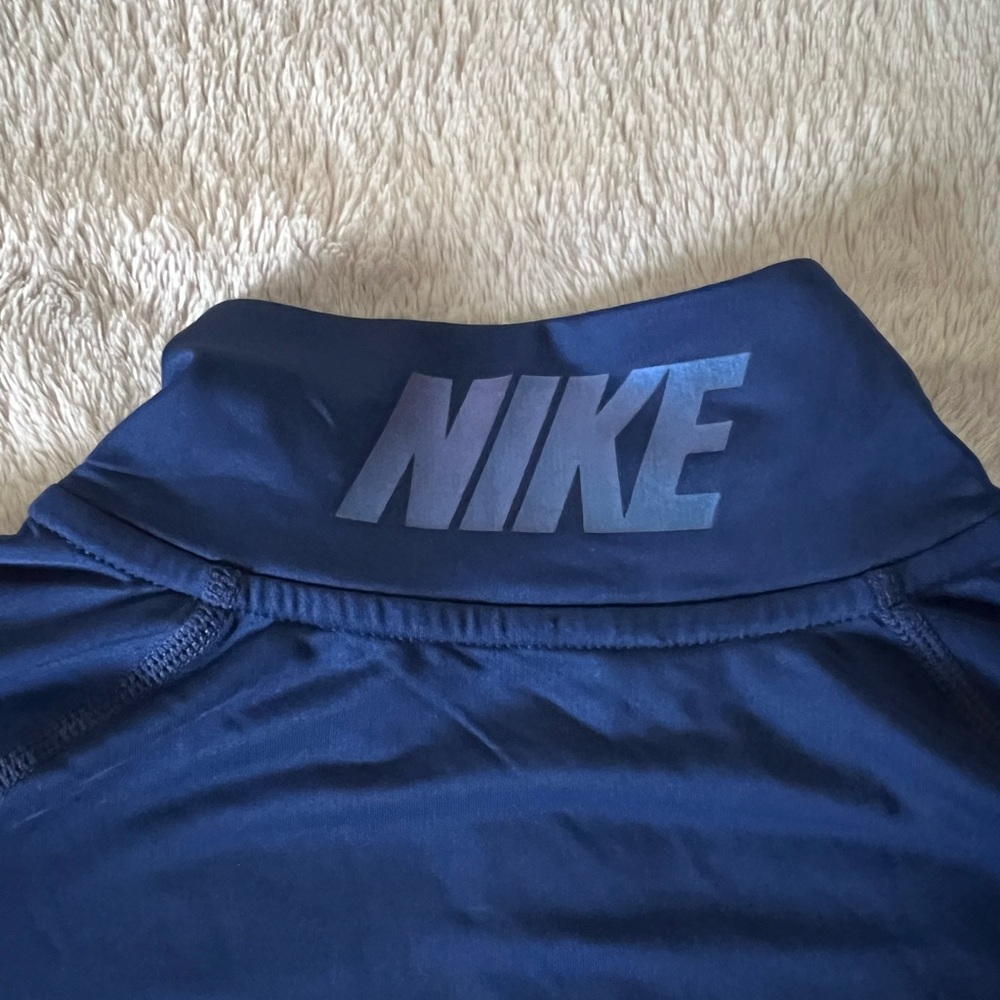 Women’s Nike Pro size medium 1/4 zip pullover.